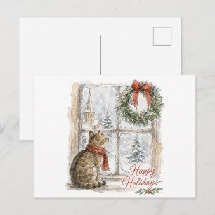 Kerstkat bij raam met krans briefkaart
