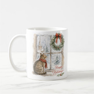 Kerstkat bij raam met krans koffiemok