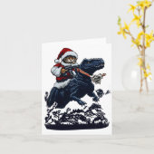 Kerstkat in kerstmuts met pistool en dinosaurus kaart (Gele Bloem)