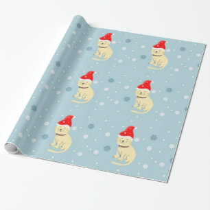 kerstkat met pet op blauw cadeaupapier