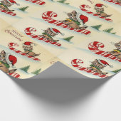 Kerstkatje rijdt op een zuurstok cadeaupapier (Hoek)