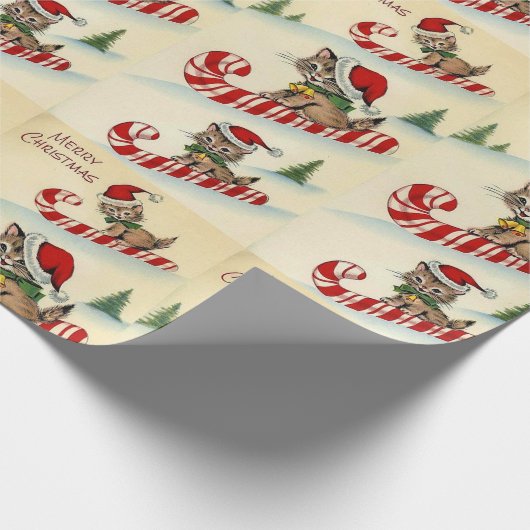 Kerstkatje rijdt op een zuurstok cadeaupapier (Hoek)