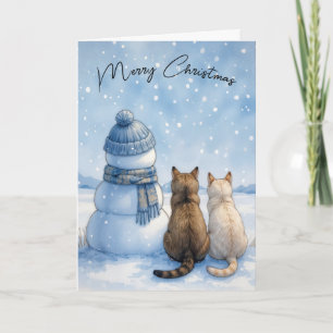 Kerstkatten zittend naast een sneeuwman in een vel kaart