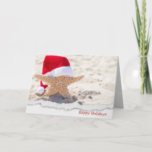 Kerstkerstkersthoed op zeester in zand feestdagen kaart (Voorkant)