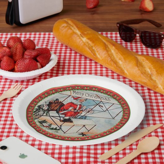 Kerstkerstman die een oud vliegtuig vliegt papieren bordje (Picknick)