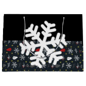 kerstkleppen en -bladeren met een zwart weefsel groot cadeauzakje (Voorkant)