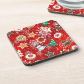 Kerstkoekjes en sneeuwvlokken op rood drankjes onderzetter (Linkerzijde)