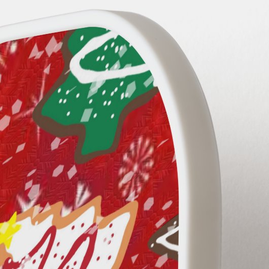 Kerstkoekjes en sneeuwvlokken op rood pickleball paddle (Links Detail)