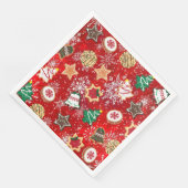 Kerstkoekjes en sneeuwvlokken op rood servet (Hoek)