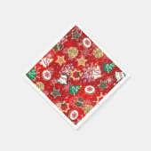 Kerstkoekjes en sneeuwvlokken op rood servetten (Hoek)