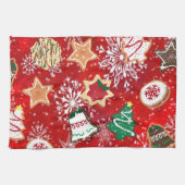 Kerstkoekjes en sneeuwvlokken op rood theedoek (Horizontaal)