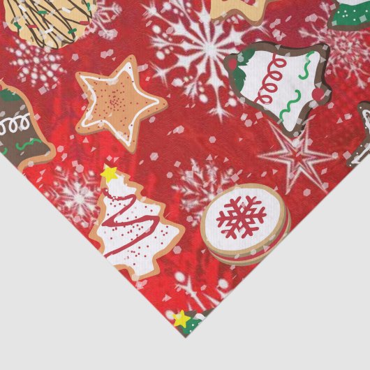 Kerstkoekjes en sneeuwvlokken op rood tissuepapier (Detail)