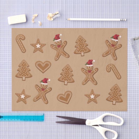 Kerstkoekvormen van gemberkoek op bruin tissuepapier (Craft)