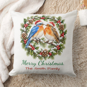 Kerstkrans met liefdesvogels op een rustieke manie kussen