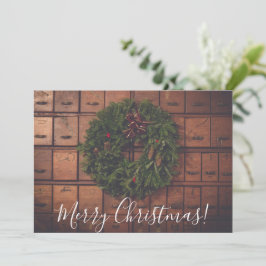 Kerstkrans op houten dozen feestdagenkaart