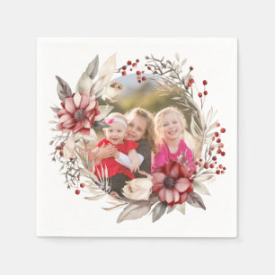 Kerstkrans, rode bloemen en bessen foto servet