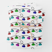 kerstlampjes ompakken van papierbladen inpakpapier vel (In situ)