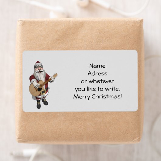 kerstliedjes spelen op zijn gitaar etiket (Insitu)