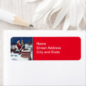 Kerstman die boeken bezorgt op kerstavond etiket (Insitu)