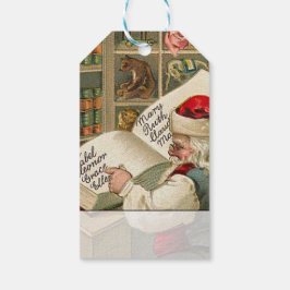 kerstman die werkt op de lijst van Naughty en Nic Cadeaulabel