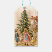 kerstman en kinderen rond kerstboom cadeaulabel (Voorkant)