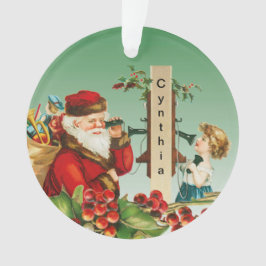 Kerstman en meisje op telefoon met naam Ornament