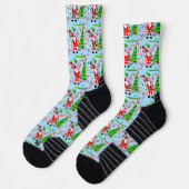 Kerstman golft bij kerstboom sokken (Links)