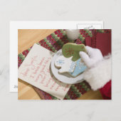 Kerstman hand met koekjes en notitie feestdagenkaart (Voorkant / Achterkant)