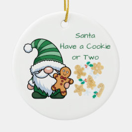 Kerstman heeft een koekje of twee op een keramisch ornament