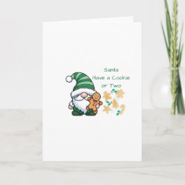 Kerstman heeft een koekje of twee op een kerstkaar kaart