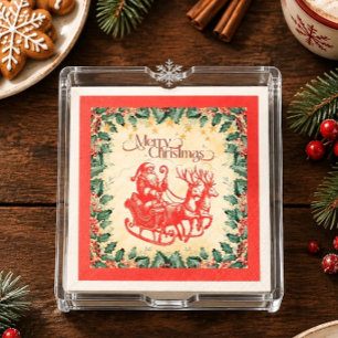 Kerstman in slee in rood papier servet