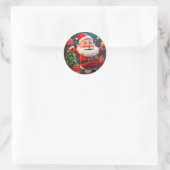 Kerstman met cadeau ronde sticker (Tas)