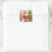 Kerstman met cadeau vierkante sticker (Tas)