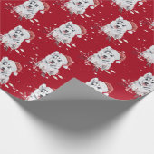 Kerstman met kerstpapier met kerstcadeautje cadeaupapier (Hoek)