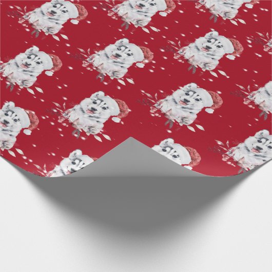 Kerstman met kerstpapier met kerstcadeautje cadeaupapier (Hoek)