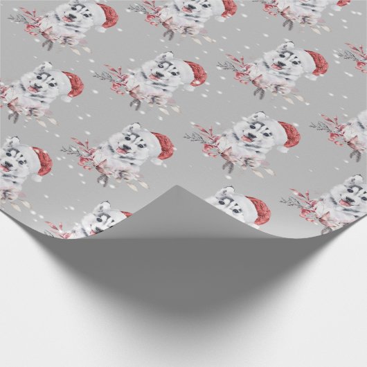 Kerstman met kerstpapier met kerstcadeautje cadeaupapier (Hoek)