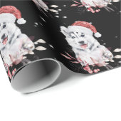 Kerstman met kerstpapier met kerstcadeautje cadeaupapier (Rol Hoek)