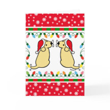 Kerstman met tweelinggele labradors