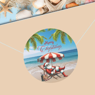 Kerstman onder een strandparasol Kerstmis Ronde Sticker