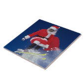Kerstman op ski's springend van een richel bij tegeltje (Zijkant)