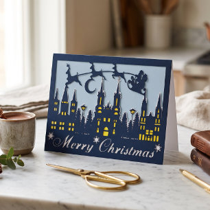 Kerstman rendier stadsgezicht papercut feestdagen kaart