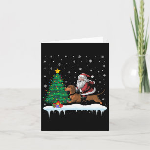 Kerstman rijdend op dachshond honden jongens meisj kaart