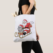Kerstman rijdt slee met een Moo Deng baby nijlpaar Tote Bag (Dichtbij)