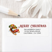 Kerstman slee vol met geschenken, kerstadres etiket (Insitu)