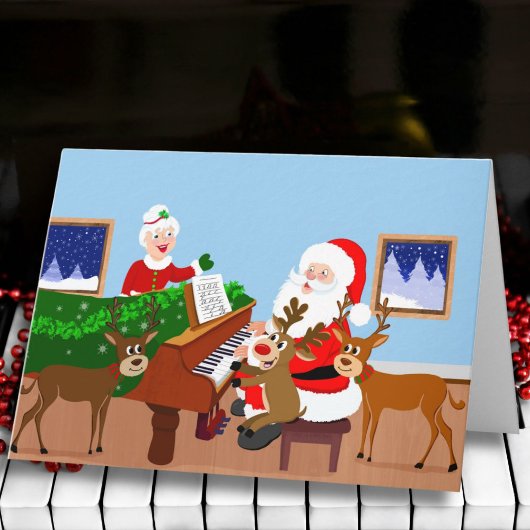 Kerstman speelt piano met rendierdeken kaart