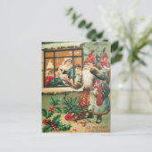 Kerstman staat voor het raam briefkaart (Staand voorkant)