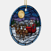 Kerstman vliegt over besneeuwd dorp keramisch ornament (Rechts)