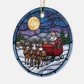 Kerstman vliegt over besneeuwd dorp keramisch ornament (Links)