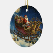 Kerstman vliegt over besneeuwd dorp kerstversierin keramisch ornament (Rechts)