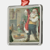  kerstman zet zijn pak aan metalen ornament (Links)